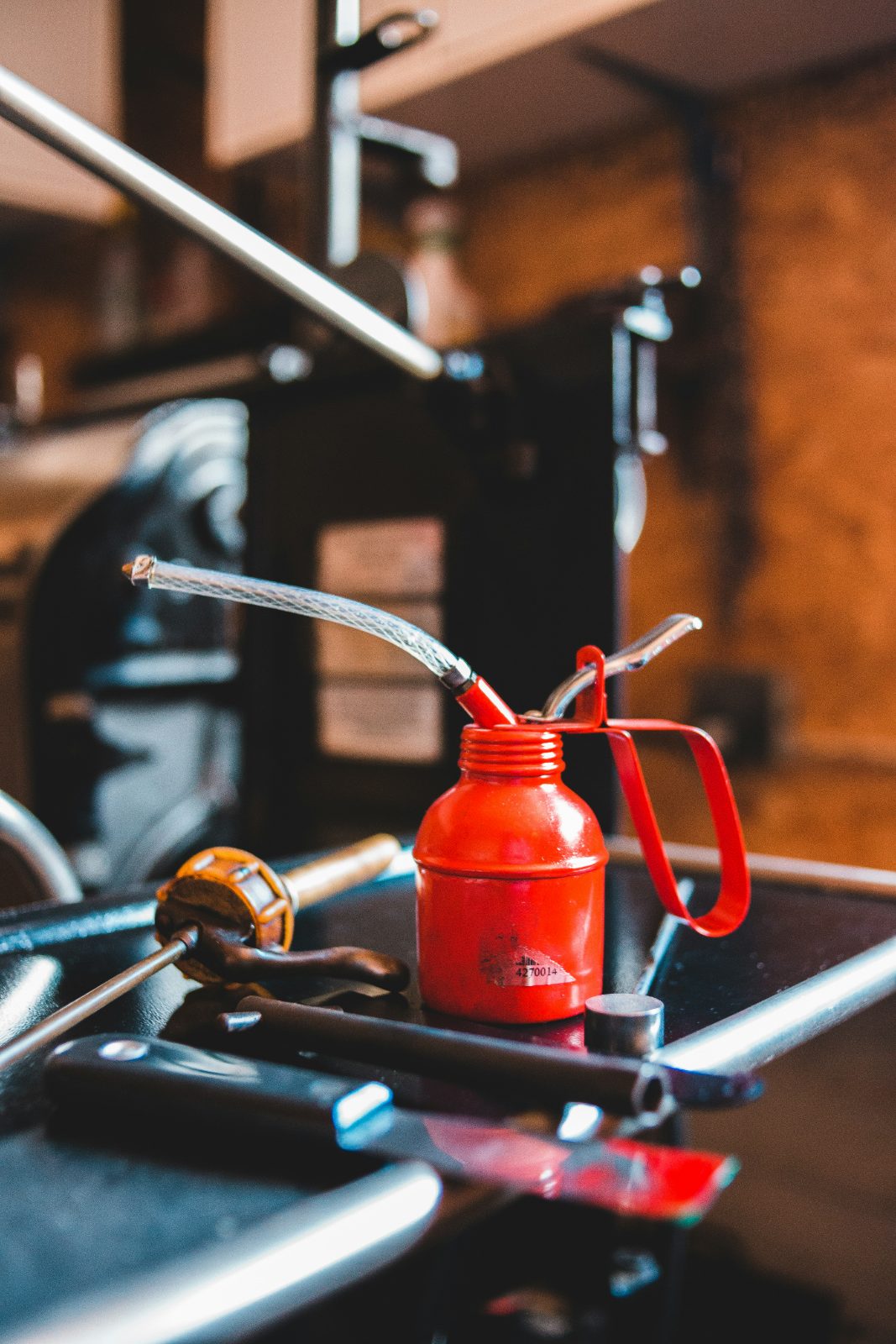 Classic oil can on a workbench at a locally owned shop
